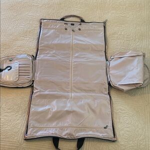 Foldable carry on garment bag NWT by Modoker. Burgandy with silver accent